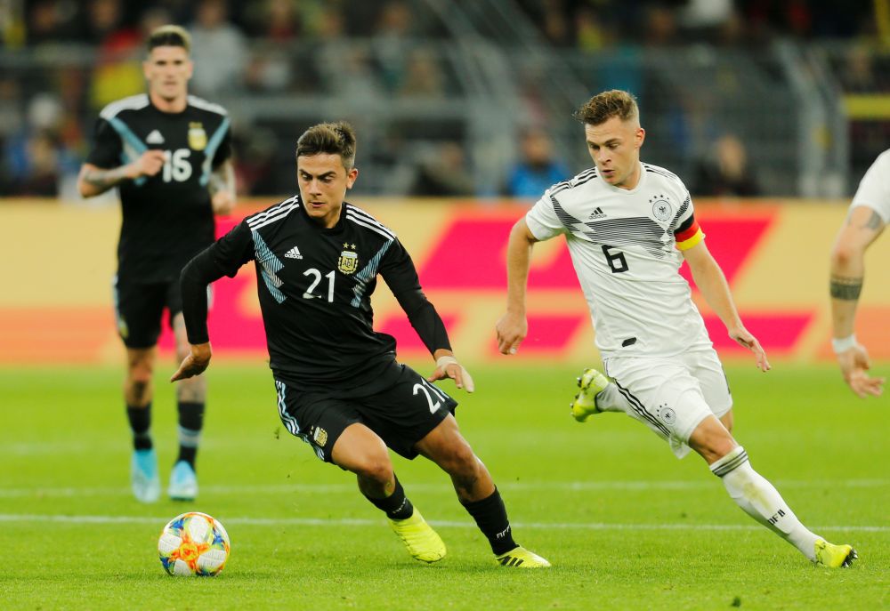 Argentina's Paulo Dybala (left) in action with Germany's Joshua Kimmich. u00e2u20acu201d Reuters pic