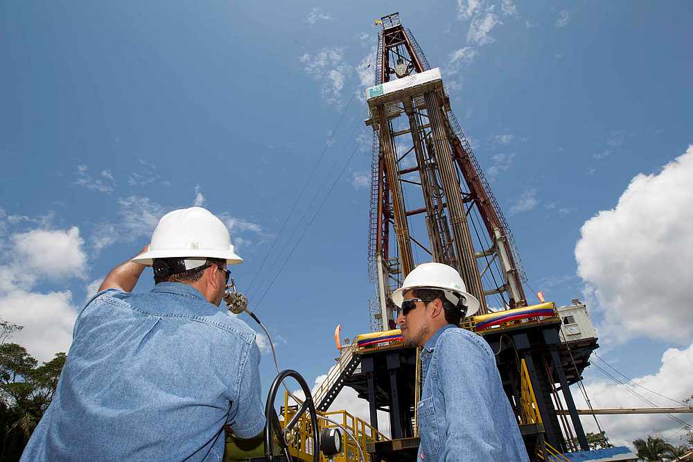 Workers stand near an oil drilling rig belonging to Petroamazonas at Miranda Port in Tiputini, Ecuador September 7, 2016. u00e2u20acu201d Reuters pic