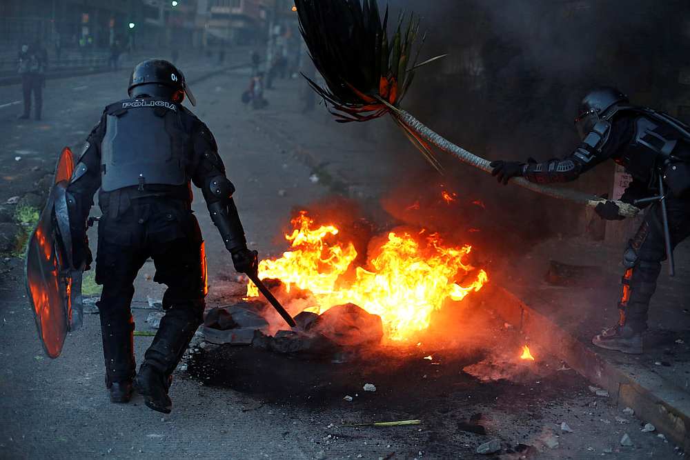 Riot police patrol remove a burning barricade set by demonstrators during protests after Ecuador's President Lenin Moreno's government ended four-decade-old fuel subsidies, in Quito, Ecuador October 4, 2019. u00e2u20acu201d Reuters pic 