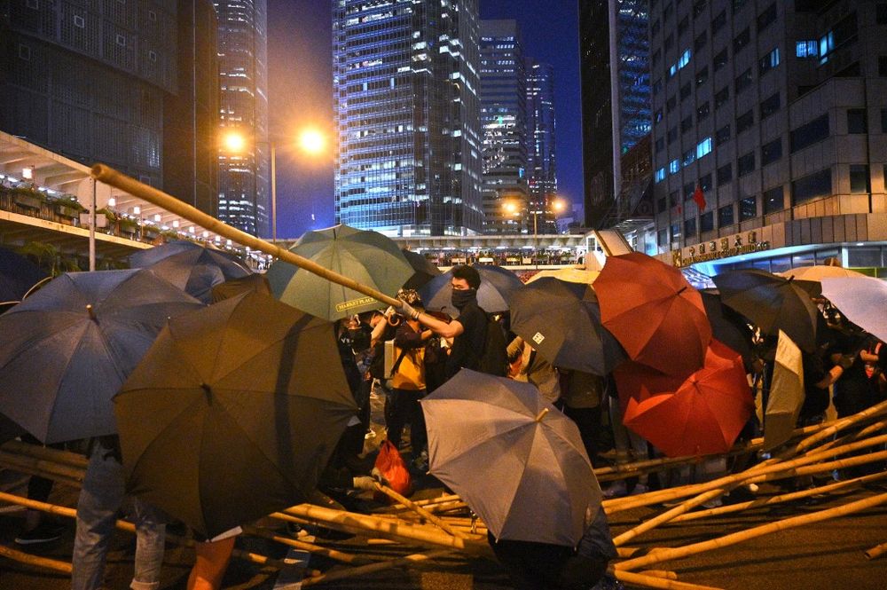 Protesters set up barricades as they gather in the Central district in Hong Kong on October 4, 2019, as people hit the streets after the government announced a ban on facemasks. u00e2u20acu201d AFP pic