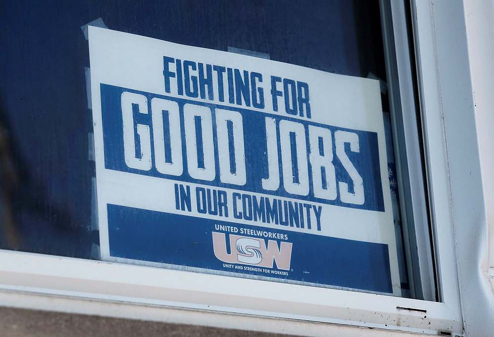 A 'Fighting For Good Jobs' sign is seen in the window of Steelworkers Local 1299 union hall in Ecorse, Michigan September 24, 2019. u00e2u20acu201d Reuters pic