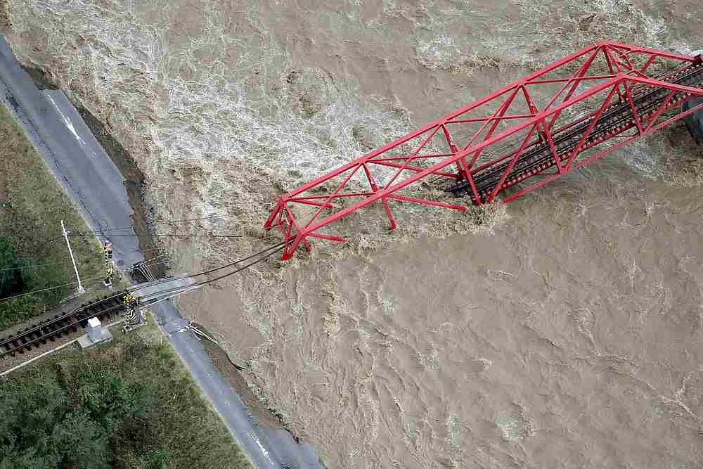 A collapsed railway bridge is seen over Chikuma river swollen by Typhoon Hagibis in Ueda, central Japan, October 13, 2019. u00e2u20acu201d Kyodo pic via Reuters
