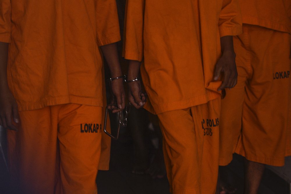 BE MINDFUL OF RACIAL STEREOTYPING WHEN USING THIS PIC Handcuffed suspects are seen at the Petaling Jaya Court Complex October 18, 2019. u00e2u20acu201d Picture by Miera Zulyana