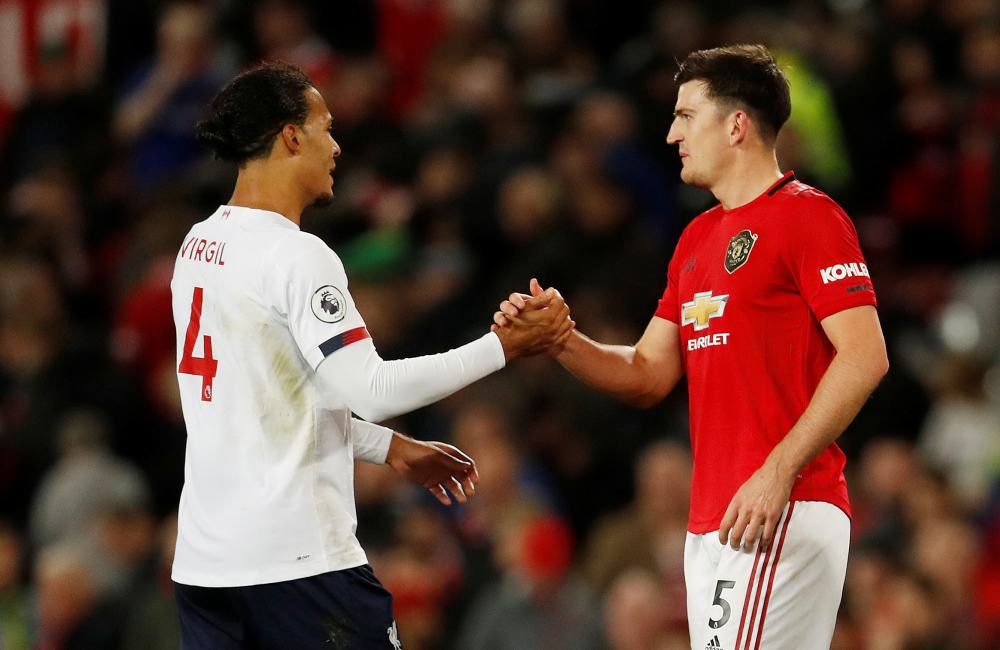 Liverpool's Virgil van Dijk shakes hands with Manchester United's Harry Maguire after the match, October 20, 2019. u00e2u20acu2022 Reuters pic