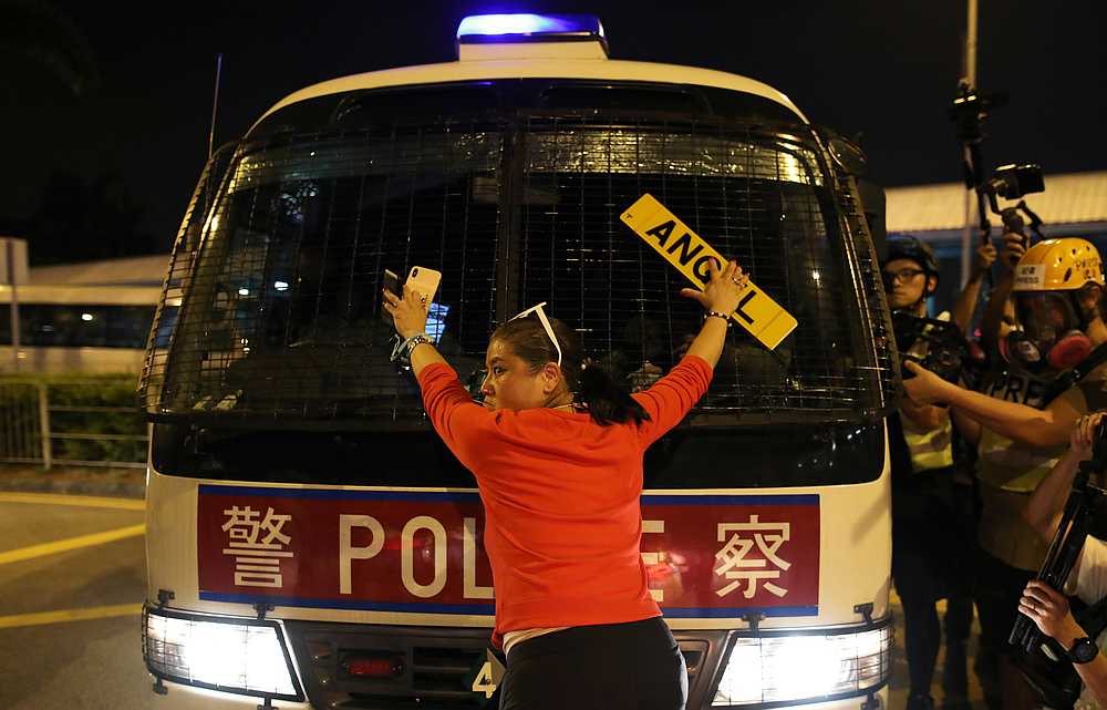 An anti-government demonstrator stands in fron of a police vehicle during a protest in Hong Kong October 14, 2019. u00e2u20acu201d Reuters pic