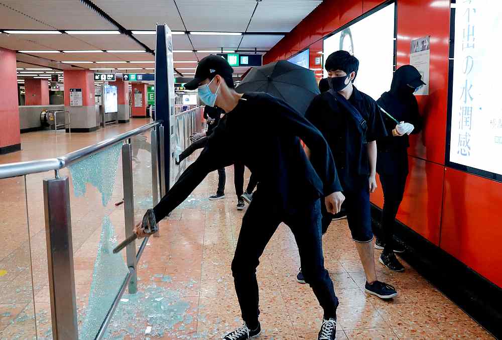 Anti-government protesters wearing masks smash Mong Kok Mass Transit Railway (MTR) station during a demonstration in Hong Kong October 4, 2019. u00e2u20acu201d Reuters pic 