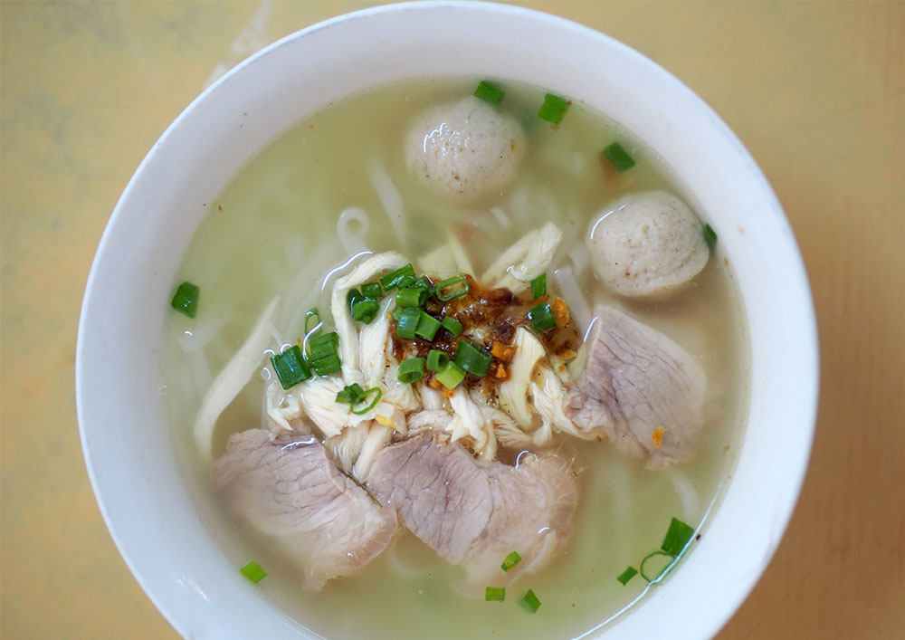 Ipoh Noodles Section 17's bowl of noodles comes packed with goodies like shredded chicken meat, fish balls and pork belly slices.