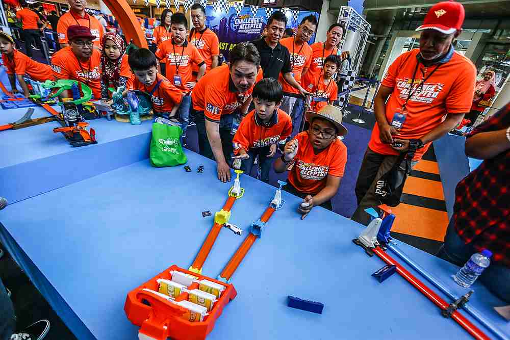 Children watch on as their cars fly through one of the obstacle courses at the Hot Wheels Challenge Accepted Championship 2019 National Finals at IOI Mall Putrajaya. u00e2u20acu201d Picture courtesy of Hot Wheels Malaysia