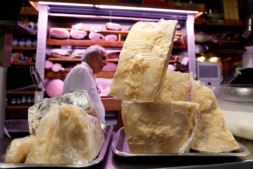 Italian Parmesan (right) and Pecorino Romano cheese are displayed on a counter at a deli in Rome October 3, 2019. u00e2u20acu201d Reuters pic