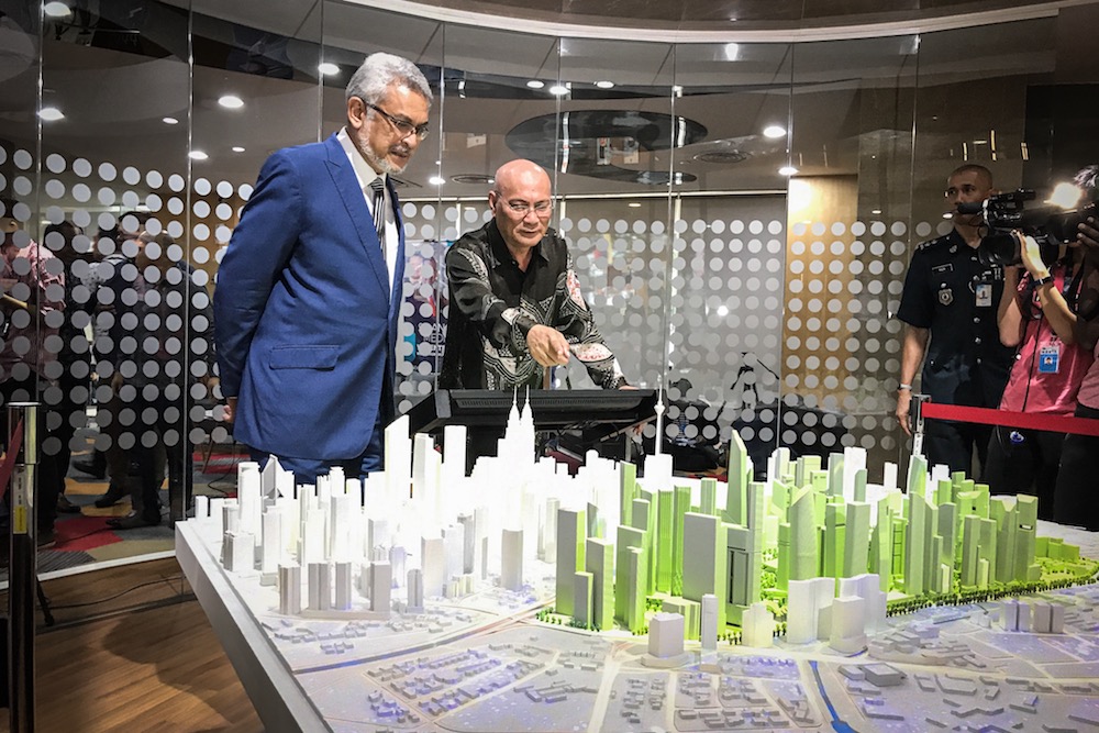 Federal Territories Minister Khalid Samad and Kuala Lumpur Mayor Datuk Nor Hisham Ahmad Dahlan look a 3D replica of the Kampung Baru Redevelopment Plan at DBKL Tower in Kuala Lumpur October 24, 2019. u00e2u20acu201d Picture by Hari Anggara