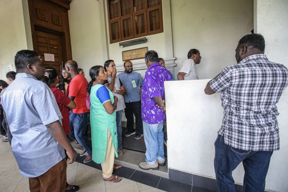Family members of suspected Liberation Tigers of Tamil Eelam sympathisers are pictured outside a courtroom at the Kuala High Court October 31, 2019. — Picture by Hari Anggara