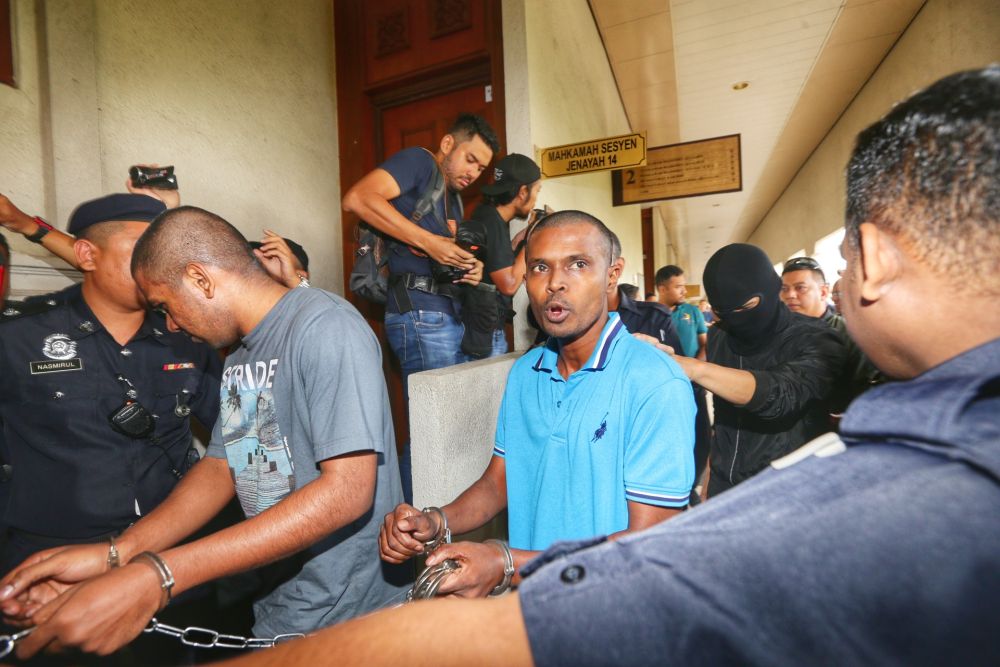 Suspected Liberation Tigers of Tamil Eelam sympathisers are escorted to the Kuala Lumpur High Court October 31, 2019. u00e2u20acu201d Picture by Ahmad Zamzahuri