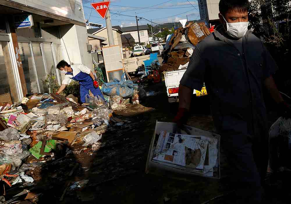 Locals clean a house, in the aftermath of Typhoon Hagibis, in Yanagawamachi district, Date City, Fukushima prefecture, Japan October 15, 2019. u00e2u20acu201d Reuters pic