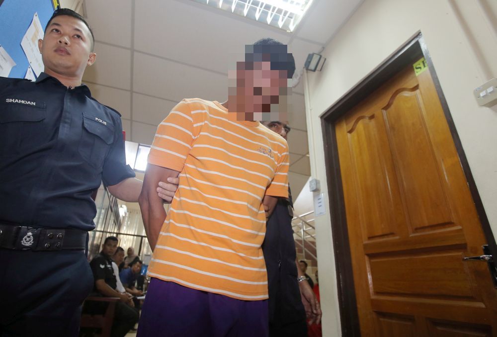 A 36-year-old fisherman was charged at the Ipoh Sessions Court in Ipoh with 22 counts of raping, molesting and having unnatural sex with his underage stepdaughter in Manjung since April 2016. u00e2u20acu201d Picture by Farhan Najib