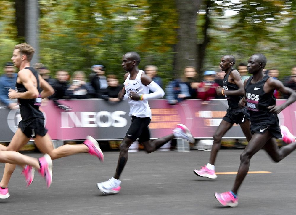 Kenyau00e2u20acu2122s Eliud Kipchoge (white jersey) runs during his attempt to bust the mythical two-hour barrier for the marathon on October 12, 2019 in Vienna. u00e2u20acu201d AFP pic
