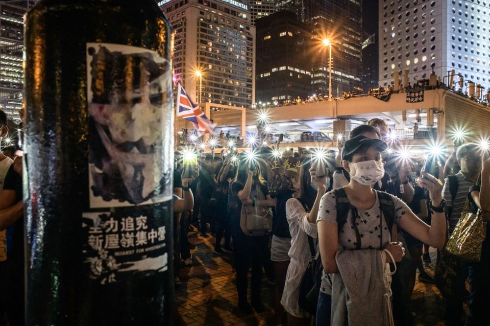 Attendees hold their mobile phones during a rally to show support for pro-democracy protesters in Hong Kong on October 19, 2019. u00e2u20acu201d AFP pic