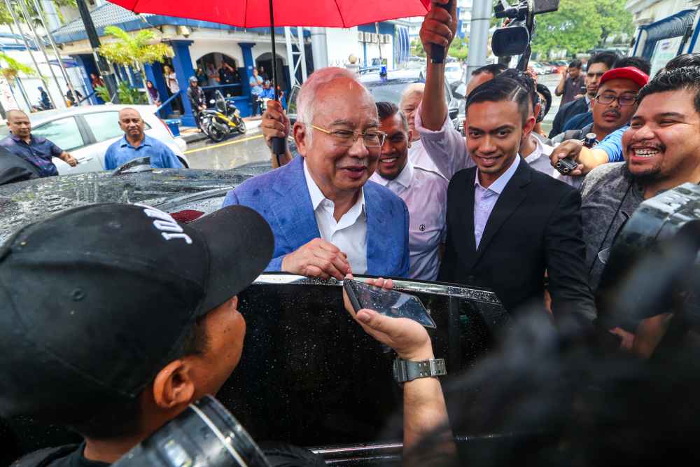 Former prime minister Datuk Seri Najib Razak speaks to reporters after giving his statement to the police at Bukit Aman October 18, 2019. u00e2u20acu2022 Picture by Firdaus Latif 