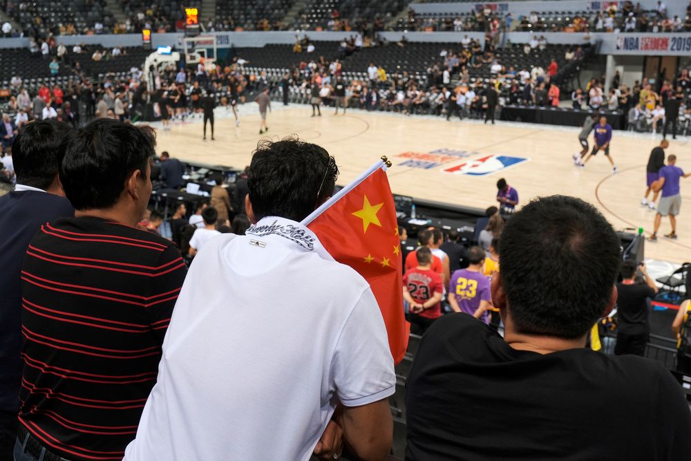A fan carries a Chinese national flag during the NBA China Games Los Angeles Lakers v Brooklyn Nets in Shenzhen, China, October 12, 2019. u00e2u20acu201d Reuters pic