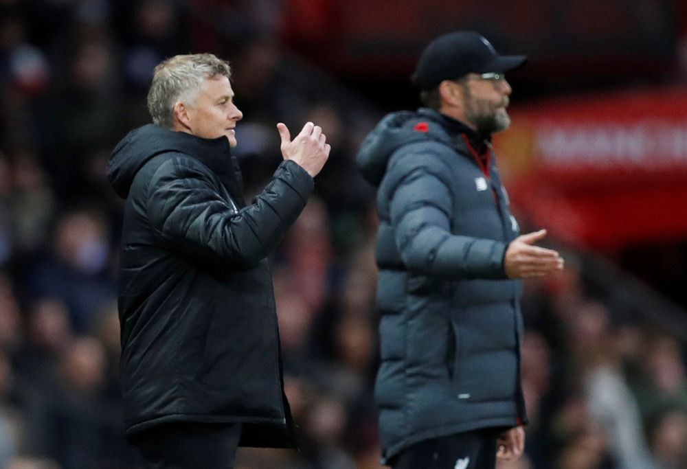 Manchester United manager Ole Gunnar Solskjaer and Liverpool manager Juergen Klopp react during the match at Old Trafford, October 20, 2019. u00e2u20acu2022 Reuters pic