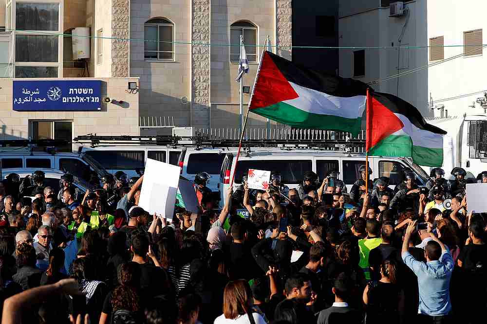 People hold Palestinian flags and placards as they protest against what Israeli Arabs citizens claim is Israeli police inaction to the violent crimes in their towns, in Majd al-Krum, northern Israel October 3, 2019.u00e2u20acu201d Reuters pic