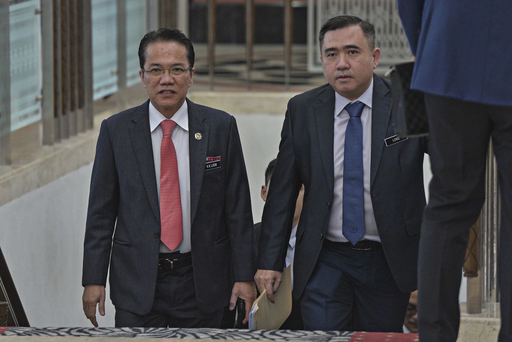 Minister in the Prime Minister's Department Datuk Liew Vui Keong (left) and Transport Minister Anthony Loke arrive at Parliament in Kuala Lumpur October 29, 2019. u00e2u20acu201d Picture by Shafwan Zaidon
