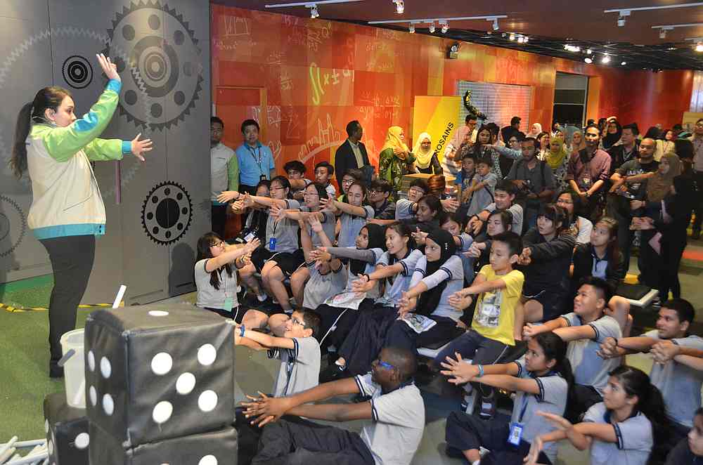 A group of school children take part in an interactive learning workshop at Petrosains. — Picture courtesy of Petrosains