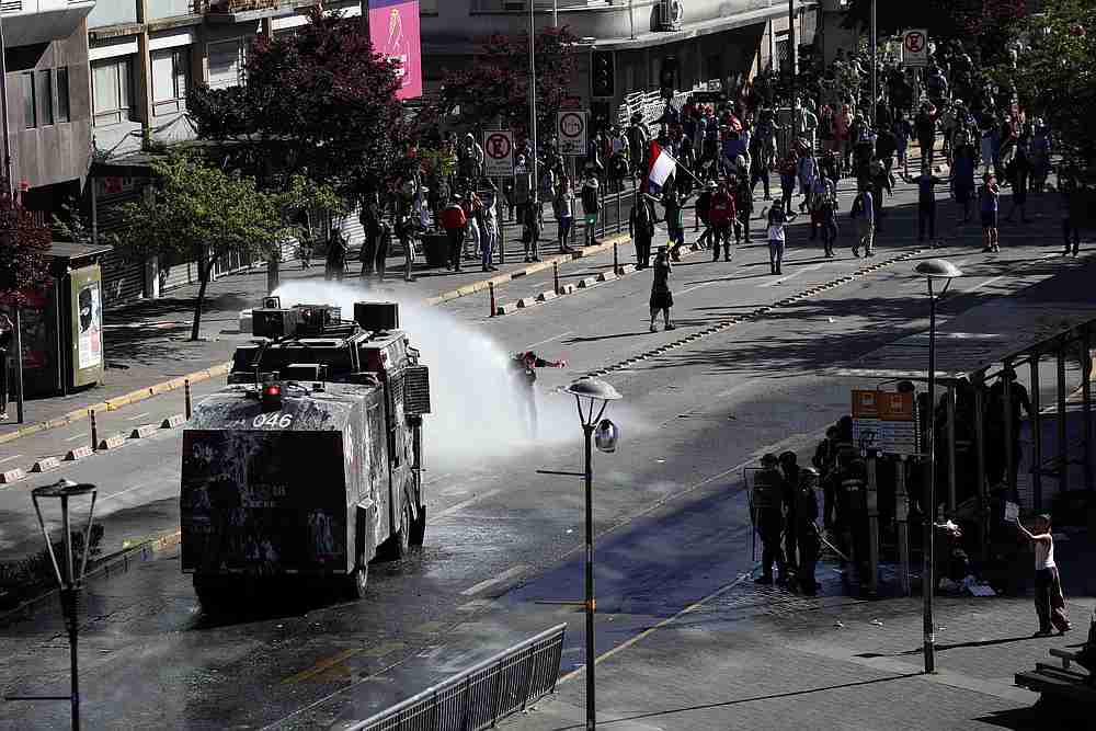 A riot police vehicle releases a jet of water during a protest against Chile's state economic model in Concepcion, Chile October 23, 2019. u00e2u20acu201d Reuters pic