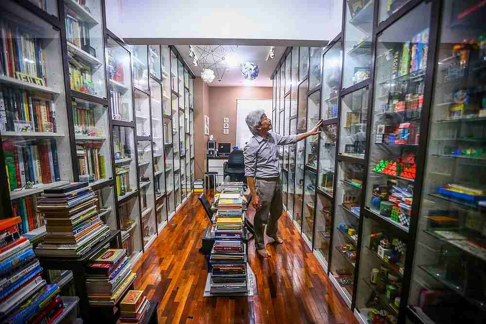 Even though he has spent two-thirds of his life surrounded by puzzles, Lee never gets tired of them and constantly plays and reads the puzzles in his collection. — Picture by Hari Anggara