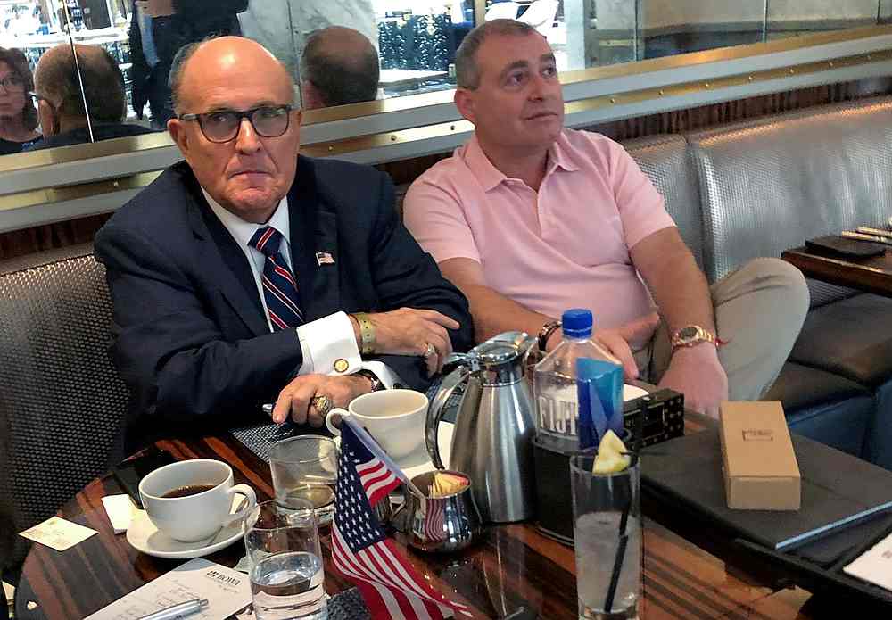 US President Donald Trump's personal lawyer Rudy Giuliani has coffee with Ukrainian-American businessman Lev Parnas at the Trump International Hotel in Washington September 20, 2019. u00e2u20acu201d Reuters 