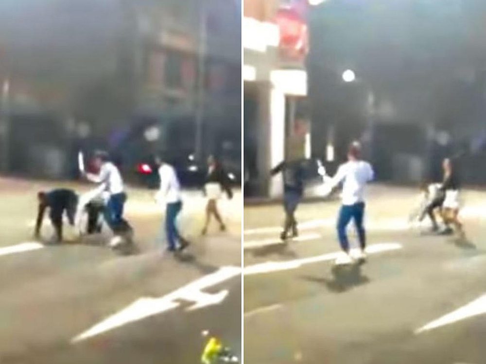 A man wearing a white shirt and blue pants was seen brandishing a long metallic object at another man. u00e2u20acu201d Image courtesy of Roads.sg via TODAY