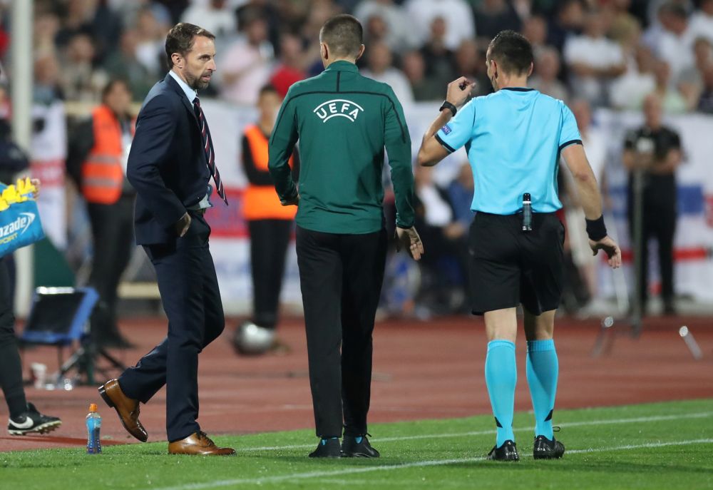 England manager Gareth Southgate speaks to referee Ivan Bebek as the match against Bulgaria is stopped during the first half. u00e2u20acu201d Reuters pic