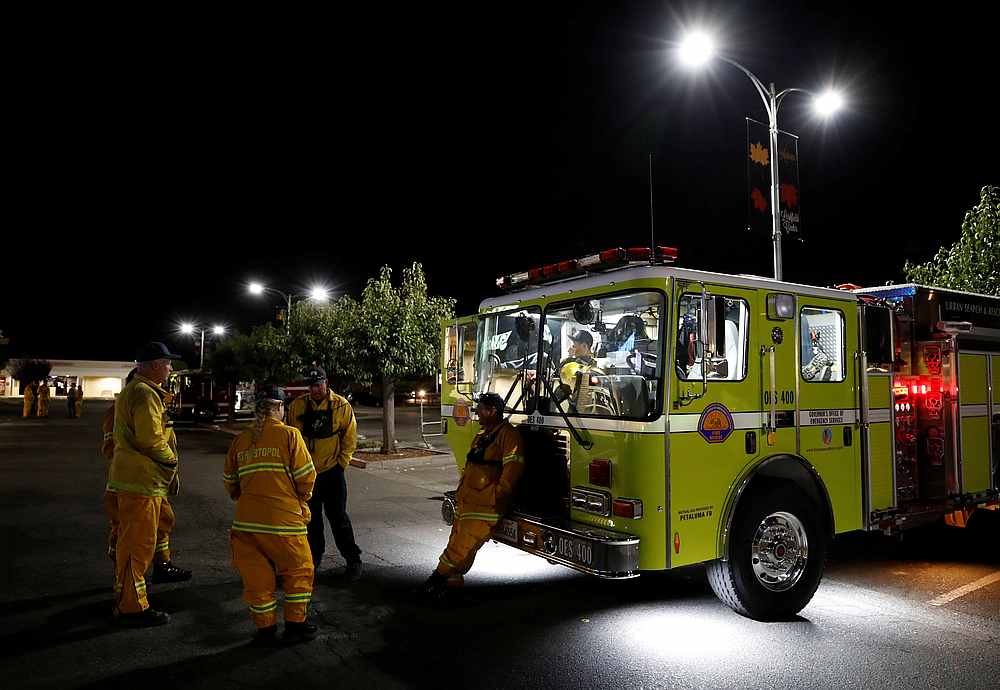 Firefighters rest in the parking lot of an evacuated shopping centre while they await their next assignment in battling the Kinkade Fire in Santa Rosa, California October 29, 2019. u00e2u20acu201d Reuters pic