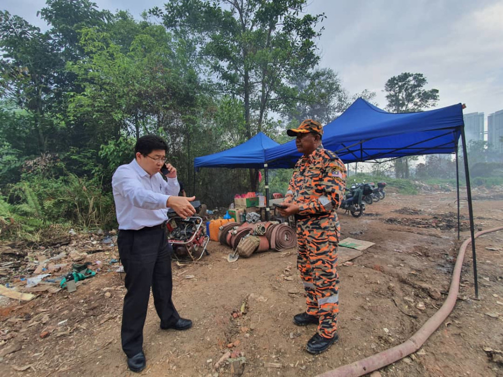 Johor Local Government, Urban Wellbeing and Environment Committee chairman Tan Chen Choon (left) visiting the illegal landfill site at the Kota Puteri Industrial Park. u00e2u20acu201d Picture courtesy of Johor Local Government, Urban Wellbeing and Environment Committ
