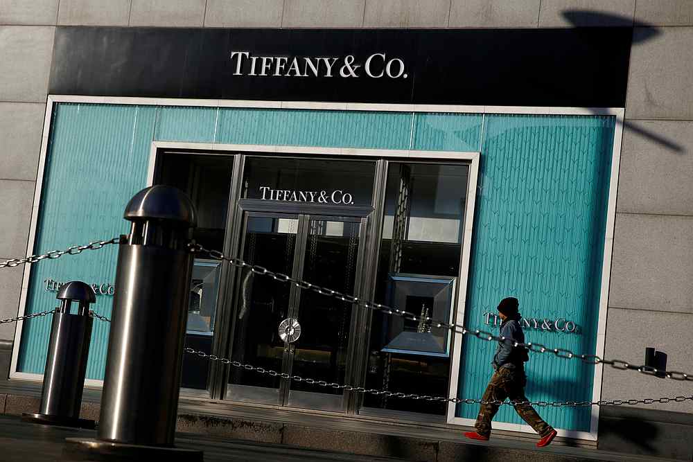 A man walks past a boutique of the luxury jewelry retailer Tiffany & Co in Beijing, China, December 1, 2016. u00e2u20acu201d Reuters pic
