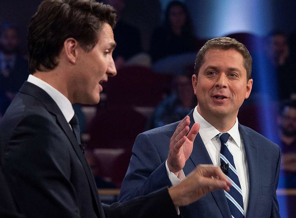 Conservative leader Andrew Scheer (right) and Liberal leader Justin Trudeau during the Federal leaders debate in Gatineau, Quebec, Canada October 7, 2019. u00e2u20acu201d  Sean Kilpatrick/Pool pic via Reuters 
