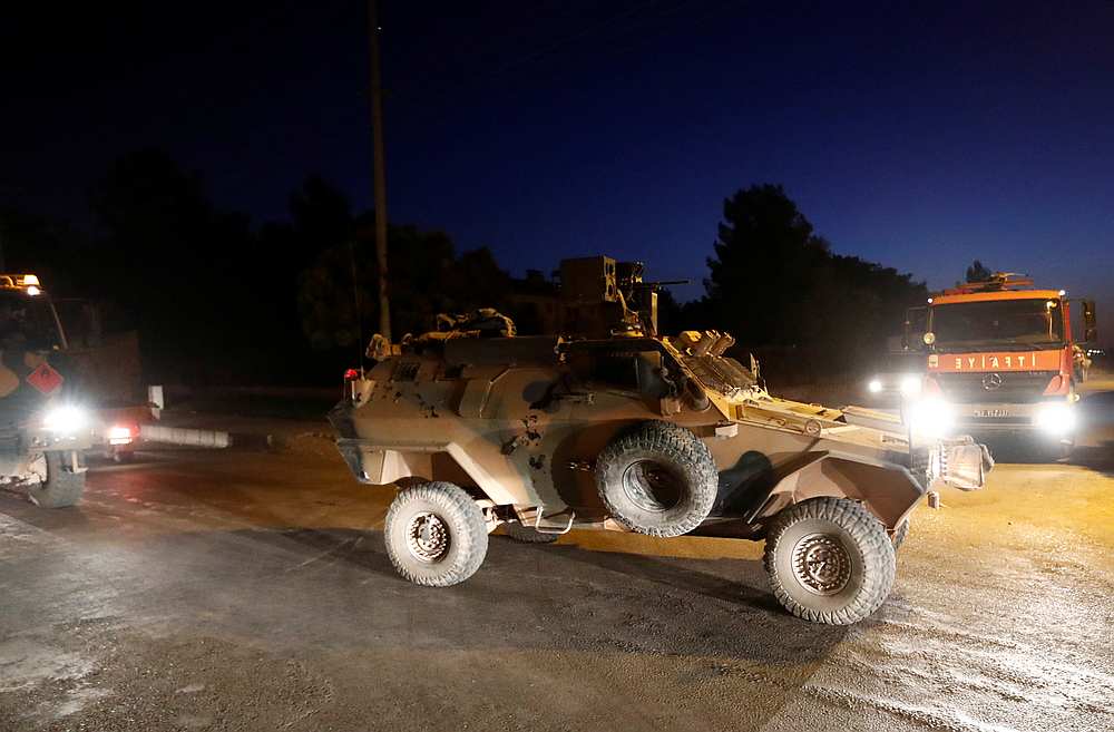 An armoured vehicle escorts a Turkish military convoy in the border town of Akcakale in Sanliurfa province, Turkey October 12, 2019. u00e2u20acu201d Reuters pic