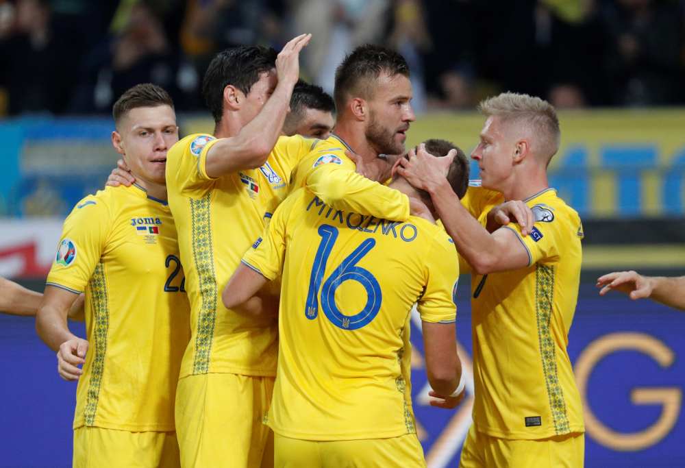 Ukraine's Andriy Yarmolenko celebrates with team mates after scoring the second goal against Portugal, October 15, 2019. u00e2u20acu2022 Reuters pic