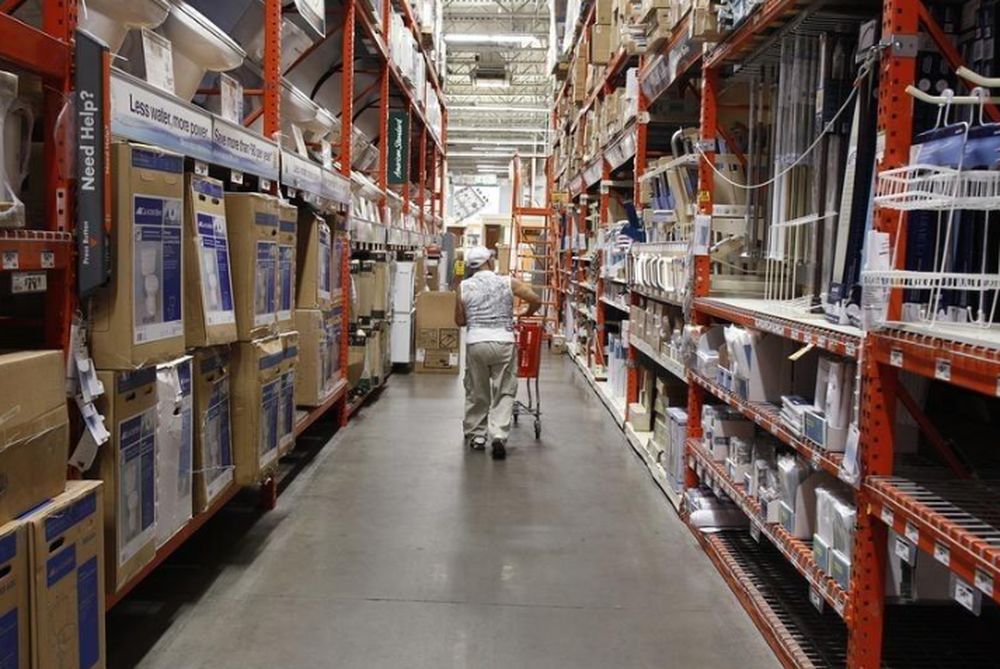 A man pushes his shopping cart down an aisle at a Home Depot store in New York, July 29, 2010. u00e2u20acu201d Reuters pic