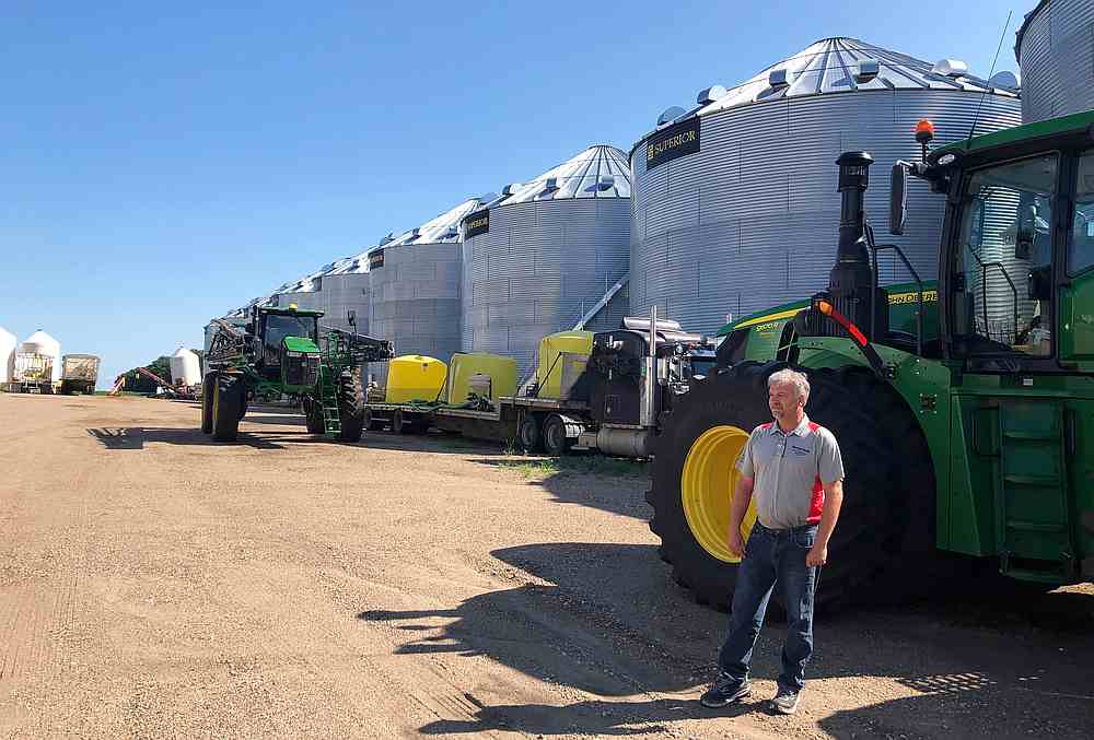 Farmer Mike Appert stands in front of some of his storage bins and machinery on his 48,000-acre farm in Hazelton, North Dakota July 22, 2019. u00e2u20acu201d Reuters 