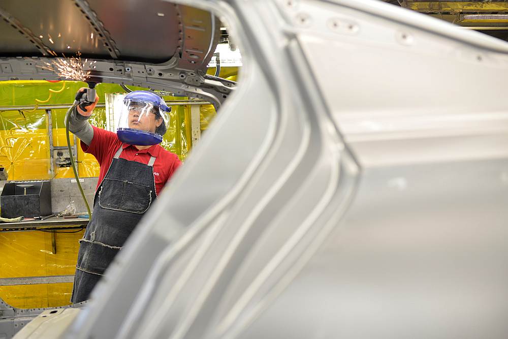 Line workers smooth out the metal along the door frames on the flex line at Nissan Motor Co's automobile manufacturing plant in Smyrna, Tennessee August 23, 2018. u00e2u20acu201d Reuters pic