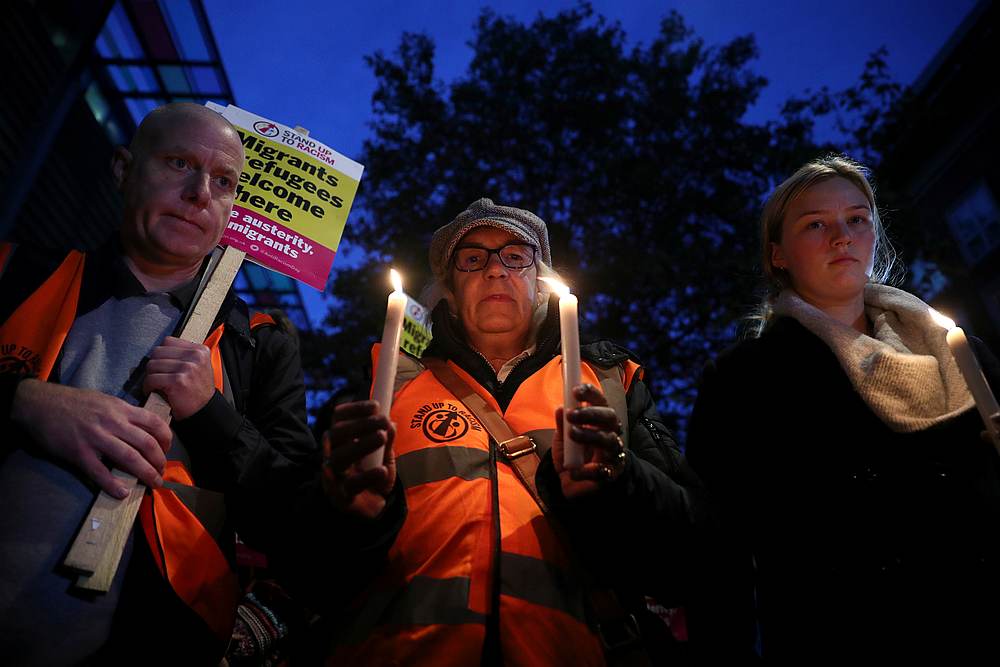 Anti-racism campaigners take part in a vigil, following the discovery of 39 bodies in a truck container,  outside the Home Office in London October 24, 2019. u00e2u20acu201d Reuters pic 