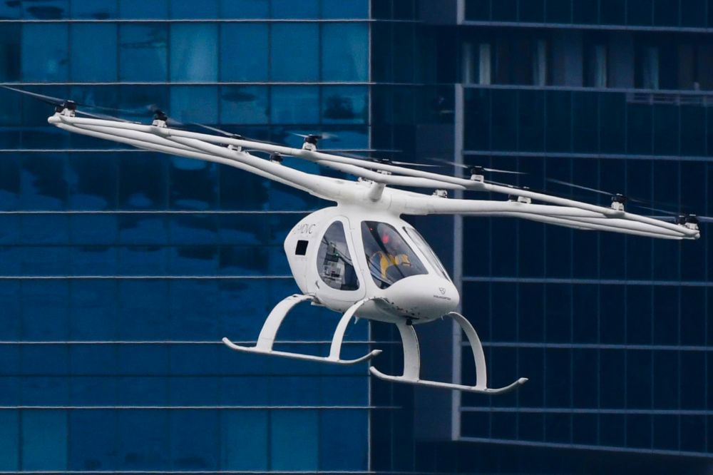 A Volocopter unmanned air taxi transport flies over Marina Bay during test flight with a safety pilot at the 26th Intelligent Transport Systems World Congress (ITSWC) in Singapore on October 22, 2019. u00e2u20acu201d AFP pic