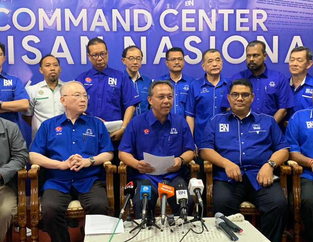 Johor Barisan Nasional chief Datuk Hasni Mohammad (centre) officially named MCA’s Datuk Seri Wee Jeck Seng as its candidate for the Tanjung Piai parliamentary by-election on November 16. — Picture by Ben Tan