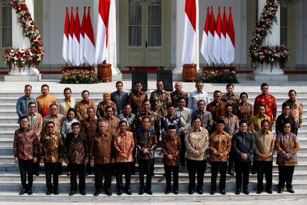 Indonesian President Joko Widodo, Vice President Ma'ruf Amin, and newly appointed cabinet ministers pose for photographers at the Presidential Palace in Jakarta, October 23, 2019. u00e2u20acu201d Reuters pic