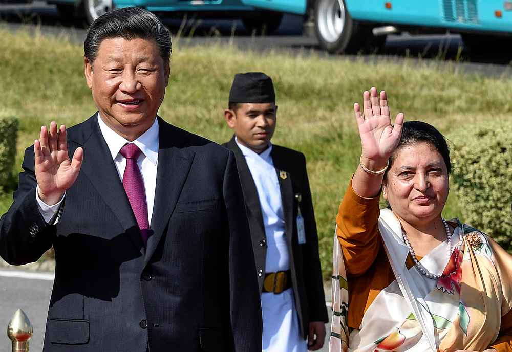 China's President Xi Jinping waves with Nepal's President Bidhya Devi Bhandari as he wraps up his two-day visit to Nepal, in Kathmandu October 13, 2019. u00e2u20acu201d Prakash Mathema/Pool pic via Reuters