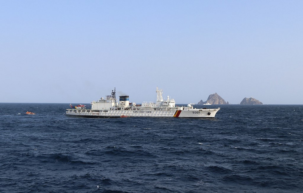 This handout photo taken on November 1, 2019 and provided by the Korea Coast Guard shows rescue members searching for missing people after a helicopter crashed into the sea near the Dokdo islets, known as Takeshima in Japan. u00e2u20acu201d AFP pic