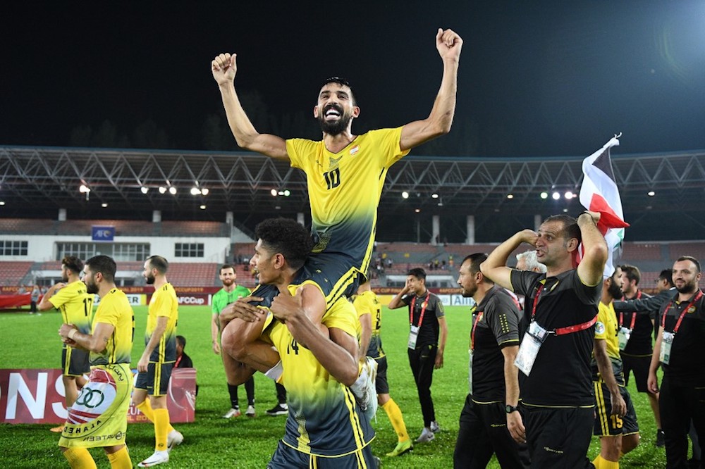 Al Ahedu00e2u20acu2122s players and coaching staff celebrate winning the 2019 AFC Cup Final with North Koreau00e2u20acu2122s April 25 Sports Club at Kuala Lumpur Stadium in Kuala Lumpur November 4, 2019. u00e2u20acu201d AFP pic