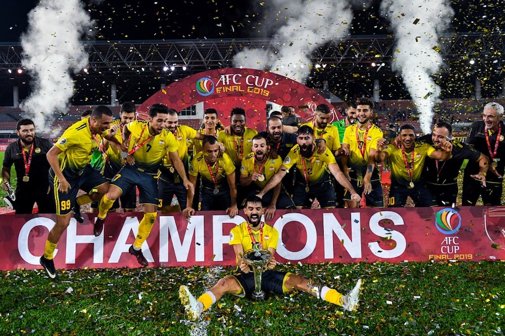 Al Ahedu00e2u20acu2122s players and coaching staff celebrate with the trophy after winning the 2019 AFC Cup Final with North Koreau00e2u20acu2122s April 25 Sports Club at Kuala Lumpur Stadium in Kuala Lumpur November 4, 2019. u00e2u20acu201d AFP pic