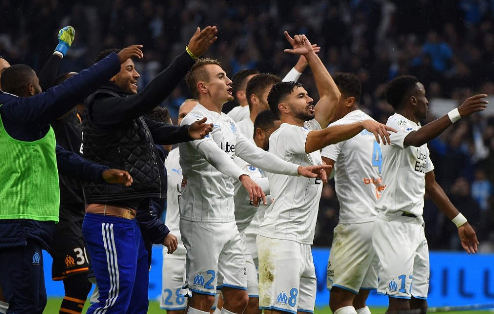 Marseille players celebrate at the end of the French L1 football match between Olympique de Marseille and Olympique Lyonnais at the Orange Velodrome Stadium in Marseille November 10, 2019. u00e2u20acu201d AFP pic