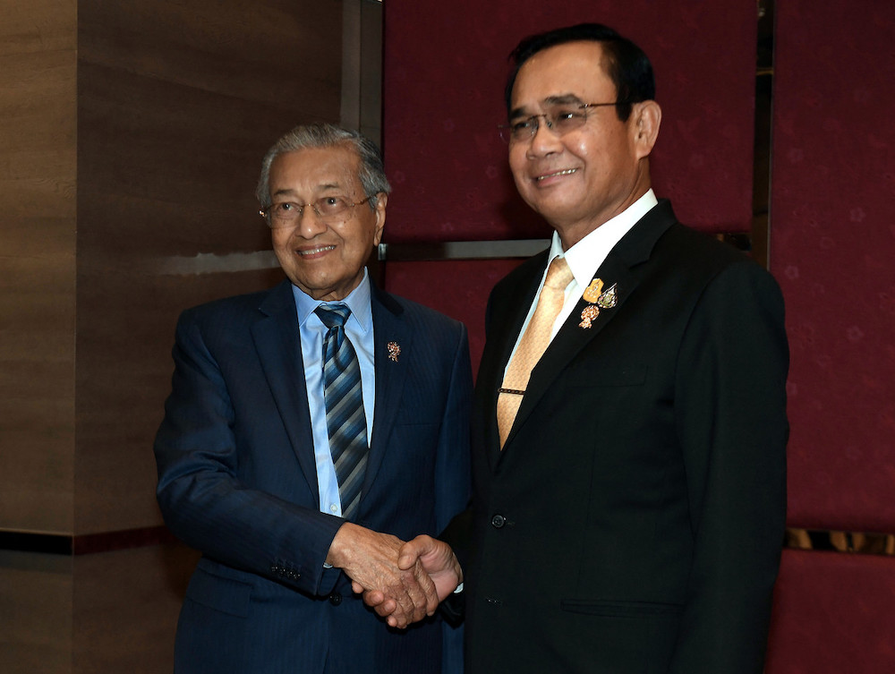 Prime Minister Tun Dr Mahathir Mohamad shaking hands with Prime Minister of Thailand General Prayut Chan-o-cha during a bilateral meeting at IMPACT Exhibition and Convention Centre, Bangkok November 2, 2019. u00e2u20acu201d Bernama pic